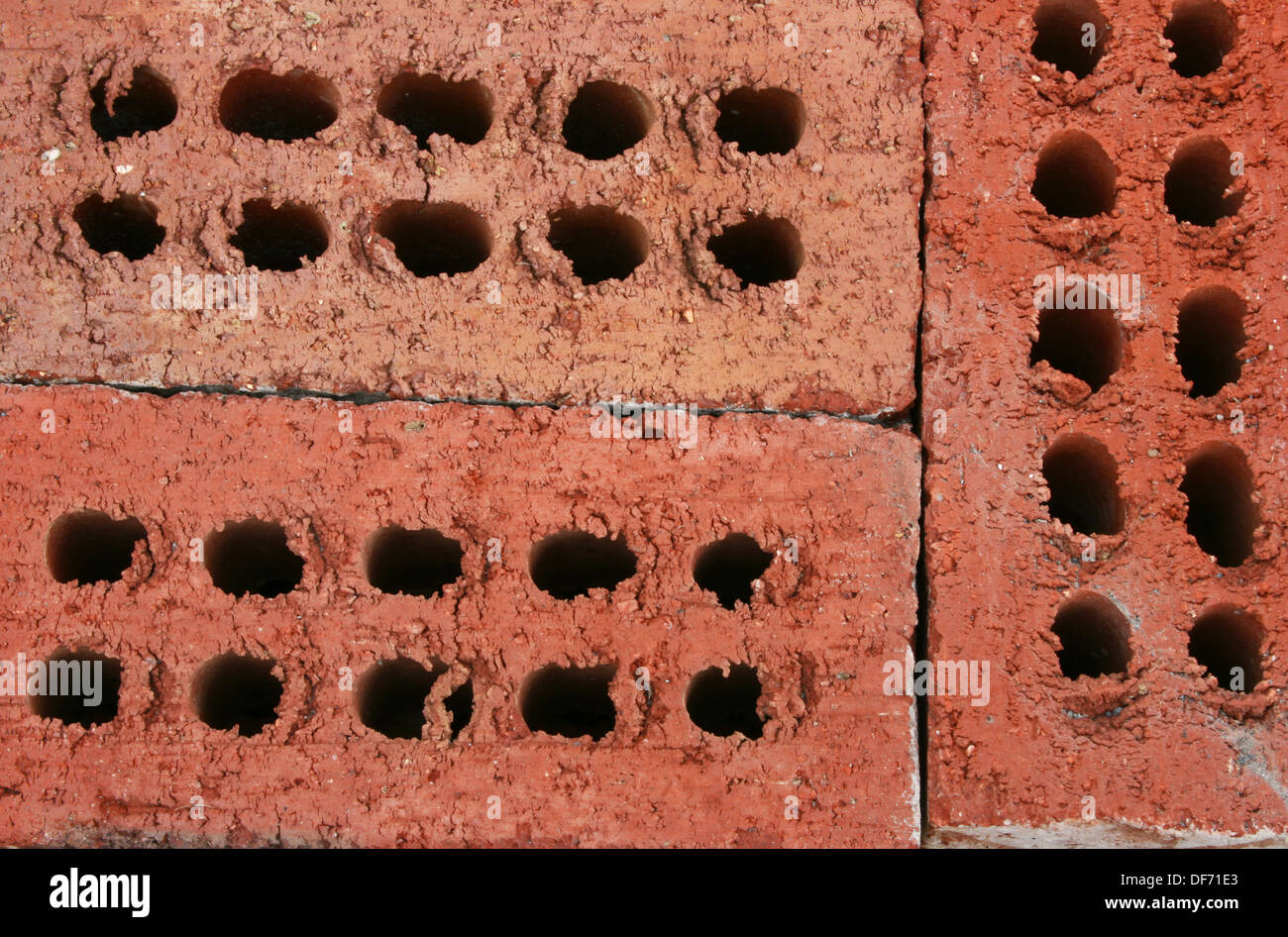 Background of three structural building bricks Stock Photo