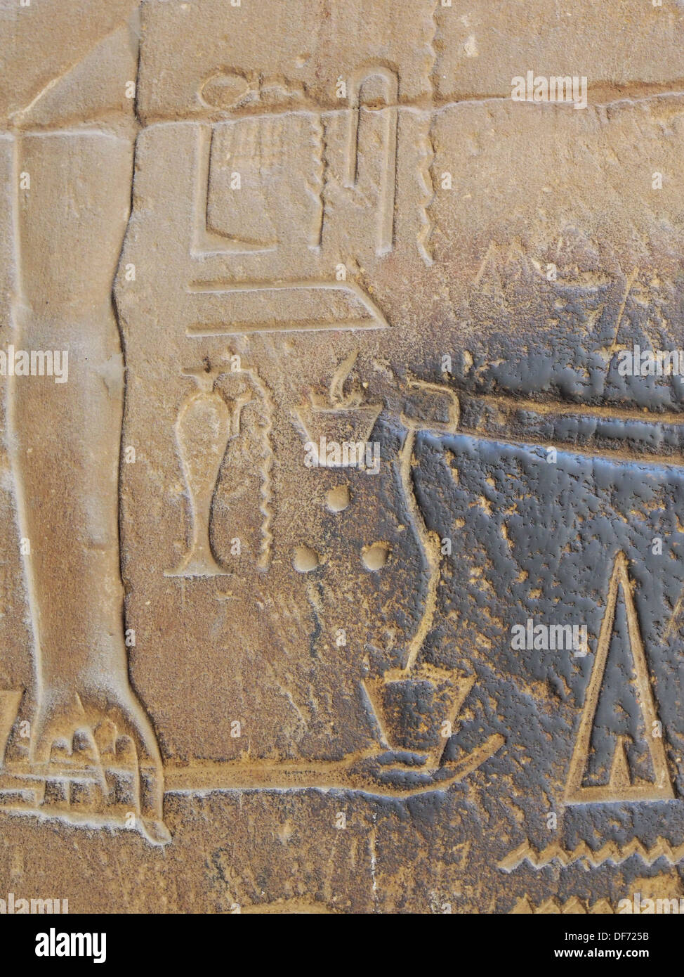 A close up of a relief carving on the wall of Luxor temple depicting the  penis of the god Min ejaculating into a cup Stock Photo - Alamy