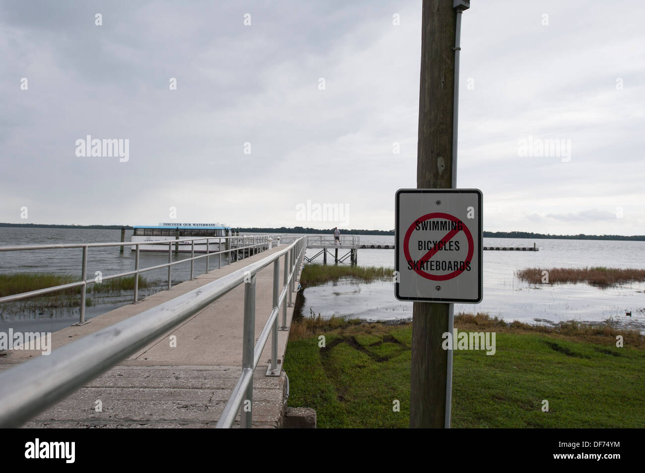 No Swimming Bicycles Skateboards Sign Posted at Wooton Park, Tavares Florida USA Stock Photo