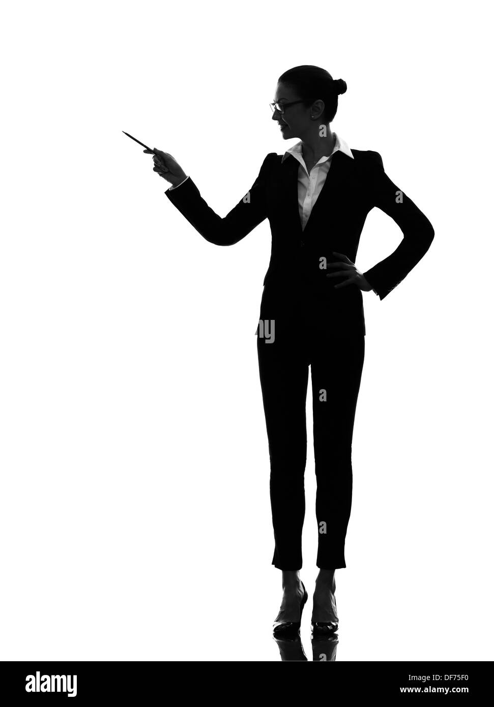 one  business woman holding pen pointing showing in silhouette on white background Stock Photo