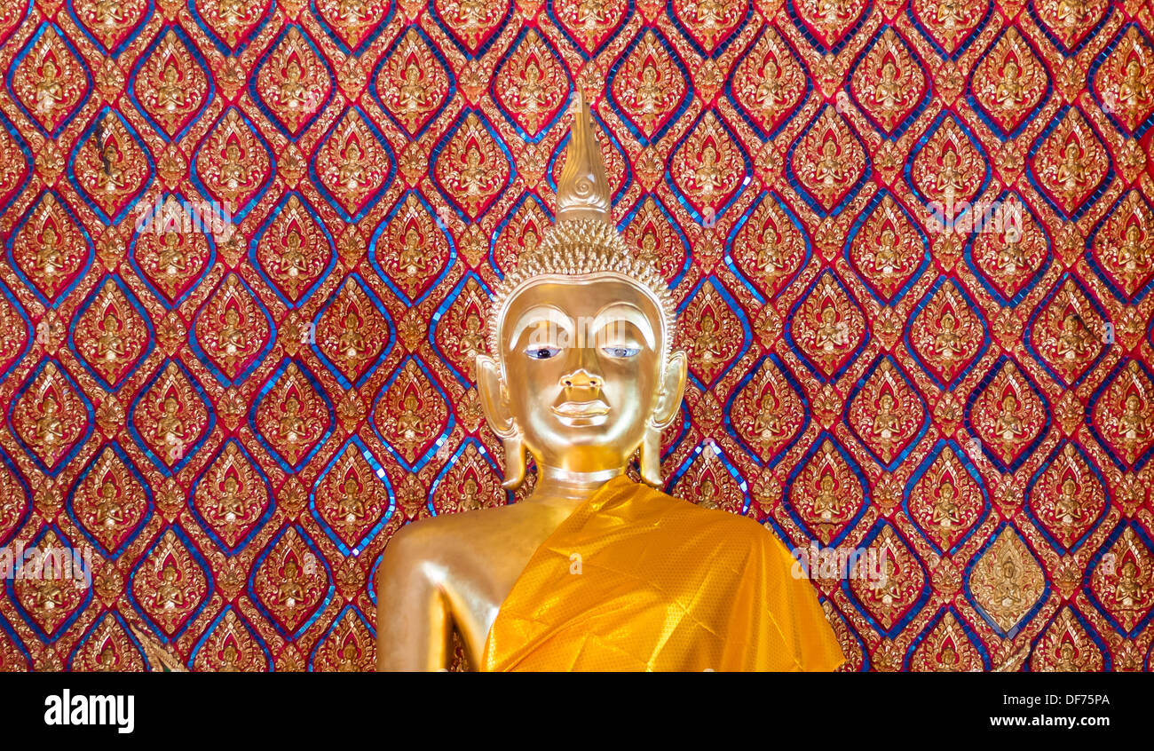 gold buddha statue in church with pattern of art thai in background ...