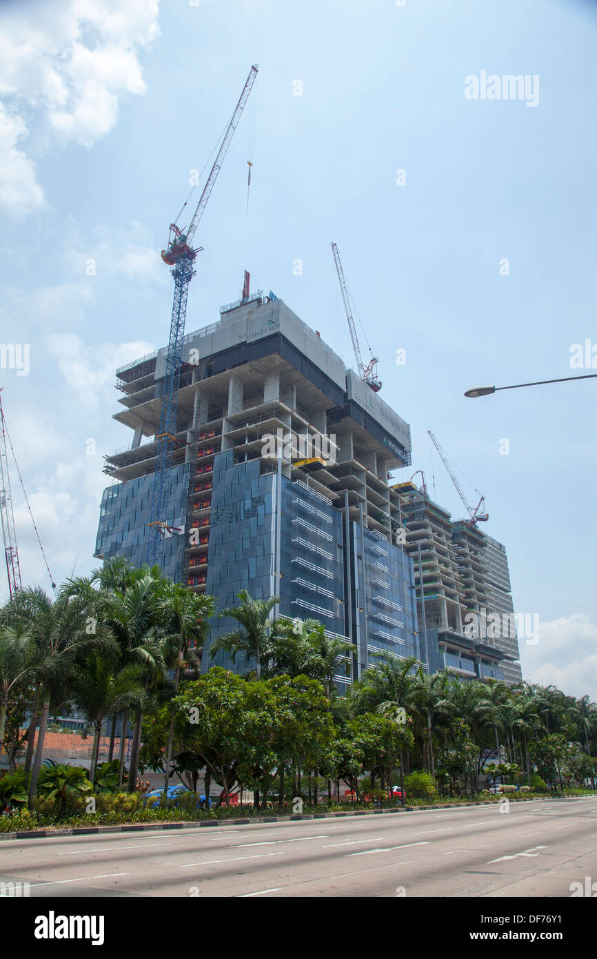 Construction site building skyscraper Singapore city Asia capital financial trade hotel offices money power works energy work Stock Photo