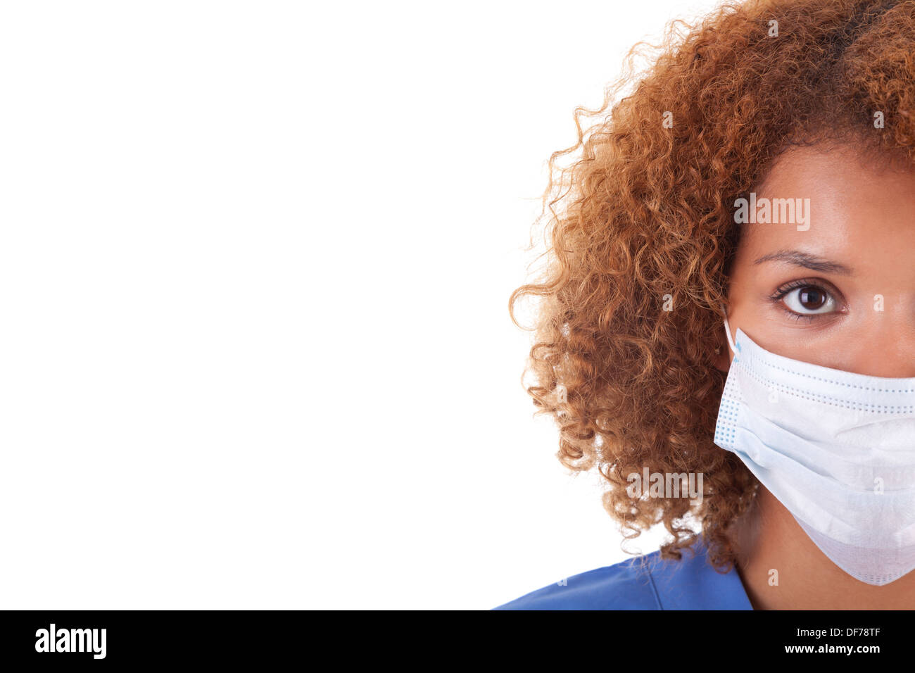 African American nurse holding a mask, isolated on white background - Black people Stock Photo