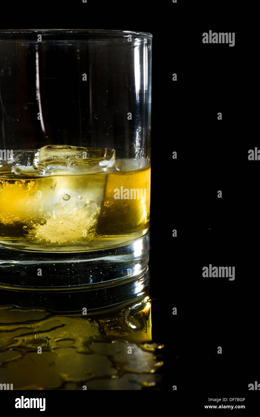 glass of whiskey on the rocks isolated on a black background Stock ...