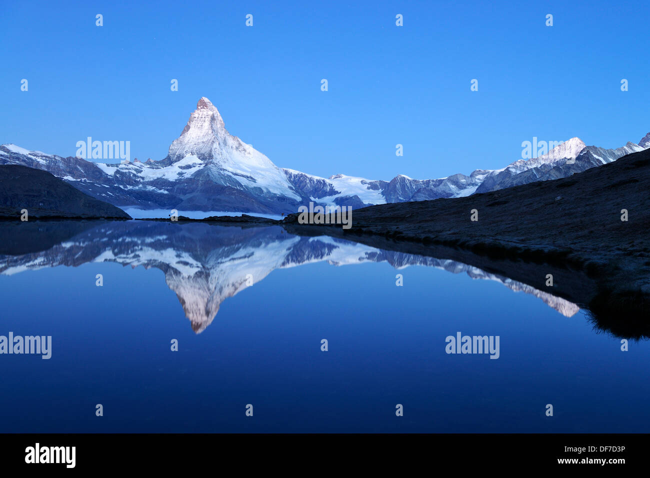 Mt Matterhorn reflected in Stellisee Lake at dusk, Zermatt, Canton of ...