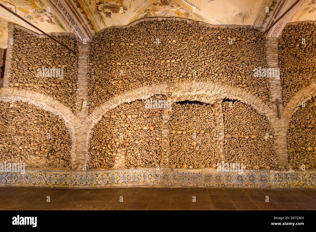 Stacked bones and skulls in the ossuary, Capela dos ossos parede, chapel of the bones, bones chapel, Évora, Évora District Stock Photo