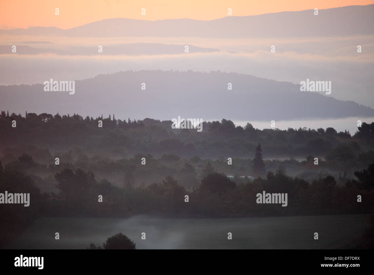 Misty sunrising above the Provence landscape. Stock Photo