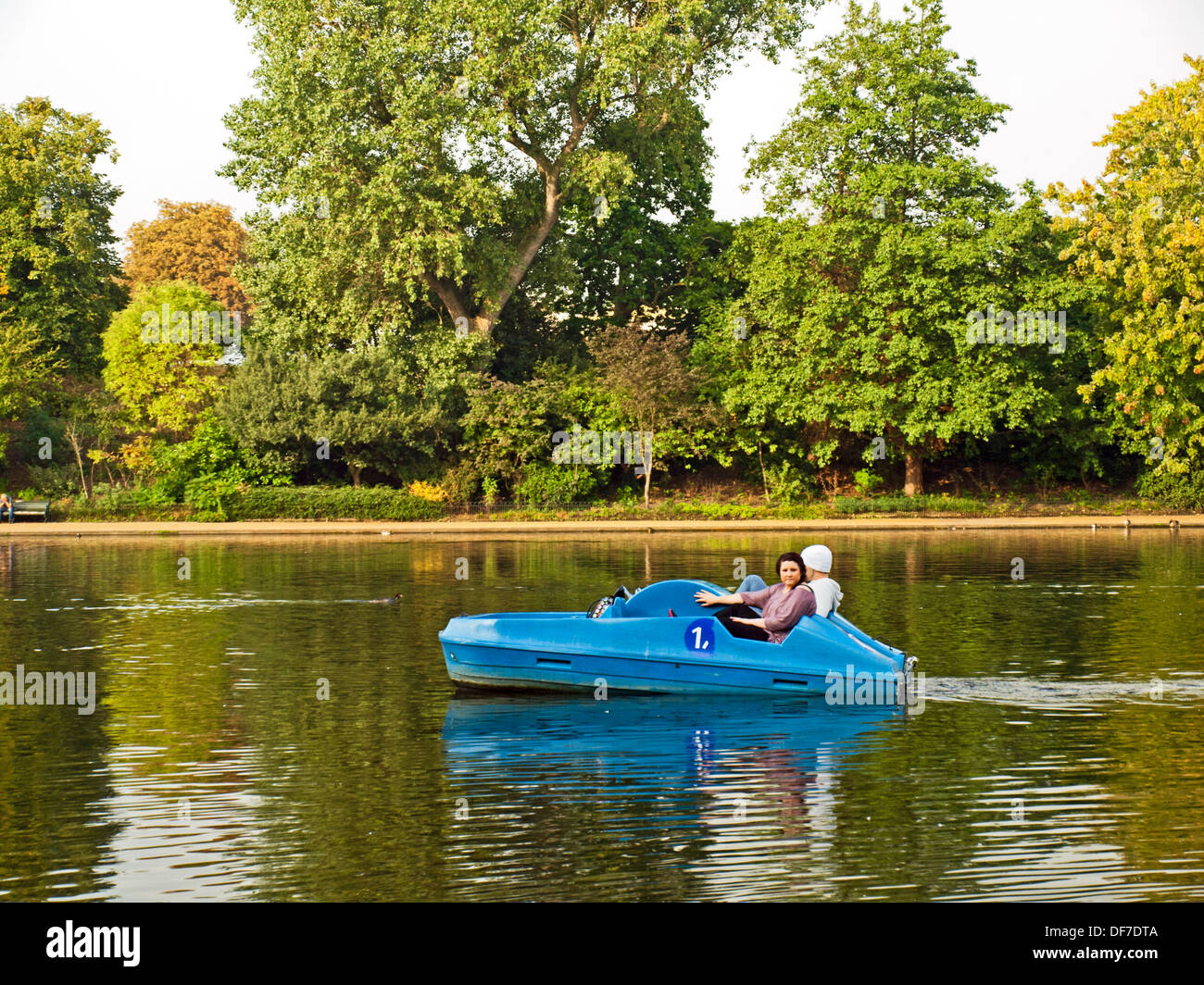 Couple in pedal boat on the Serpentine River, Hyde Park, London, England,  United Kingdom Stock Photo - Alamy