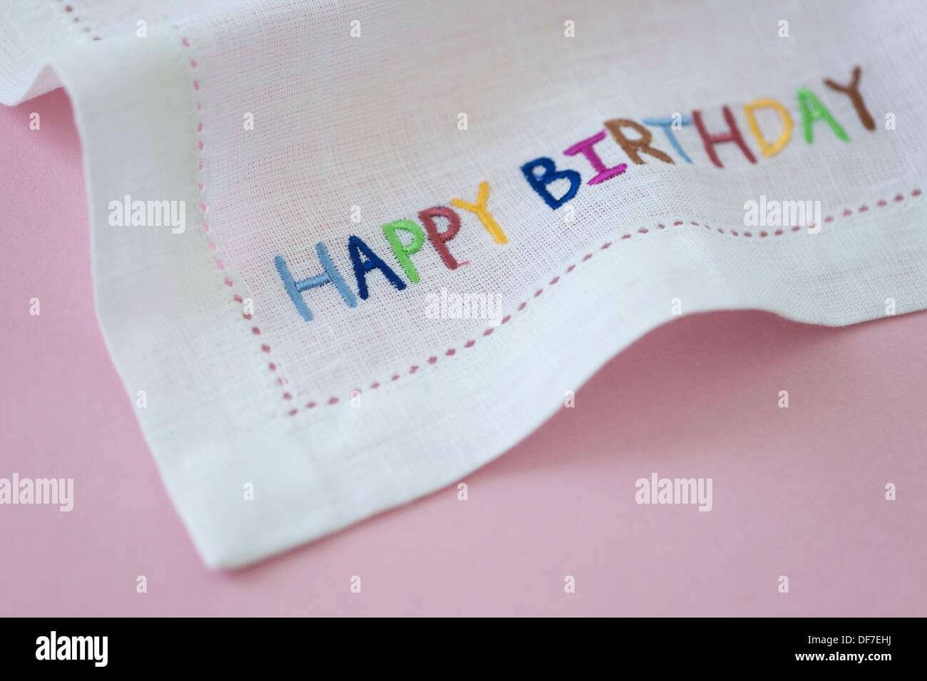 Napkin with the words Happy Birthday embroidered Stock Photo Alamy