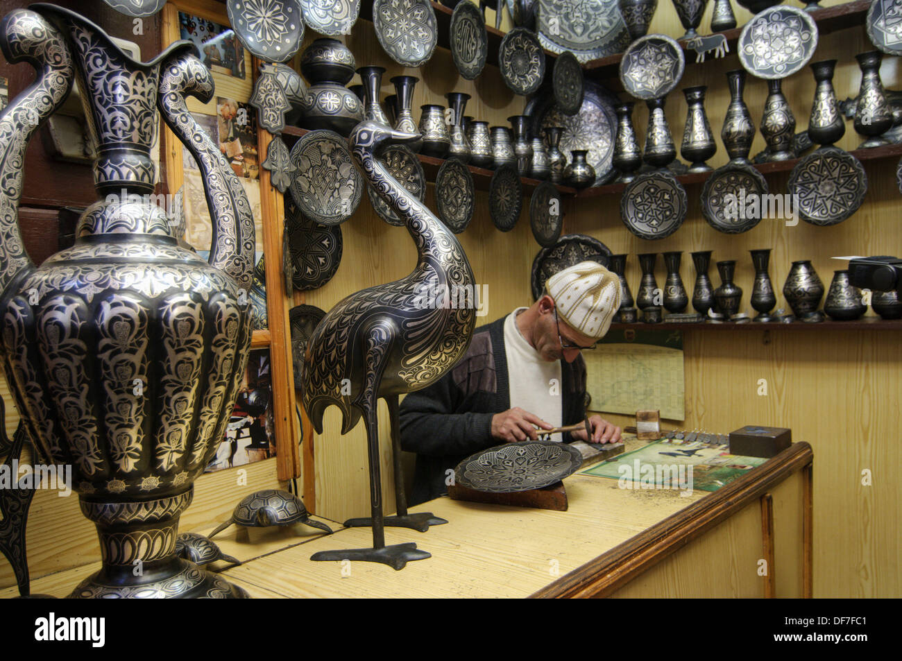 Working in silver covered crafts handwork at a shop in Fez, Morocco Stock Photo