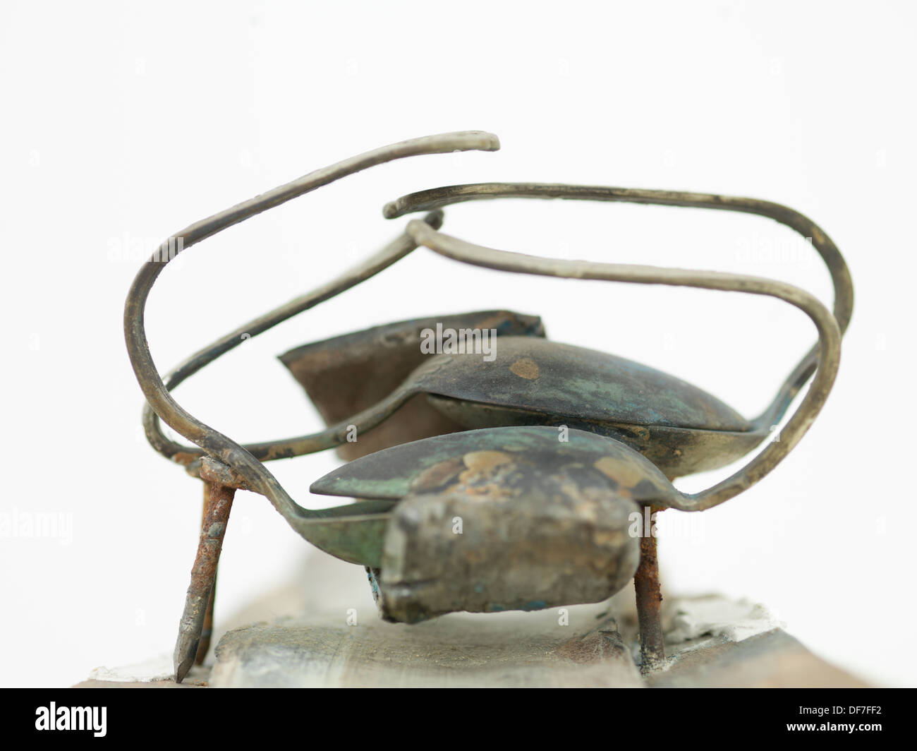 fragment of a contemporary sculpture made out of combined curved rusty spoons Stock Photo