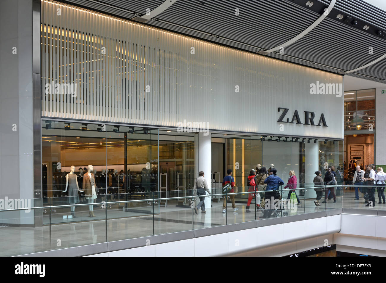 Shoppers outside Zara fashion clothing retail business shop front & store  windows in shopping mall Westfield Stratford Newham East London England UK  Stock Photo - Alamy