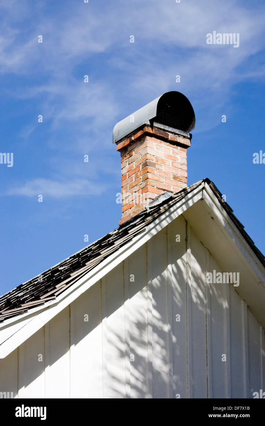 White board and batten roof gable with brick chimney on the Marjorie Keenan Rawlings home in Cross Creek, Florida. Stock Photo