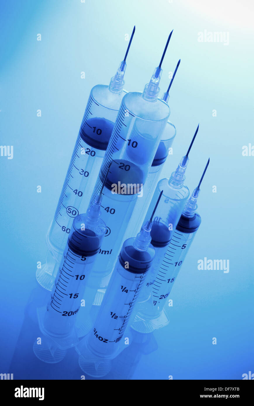 Group od syringes different sizes with blue cast Stock Photo Alamy