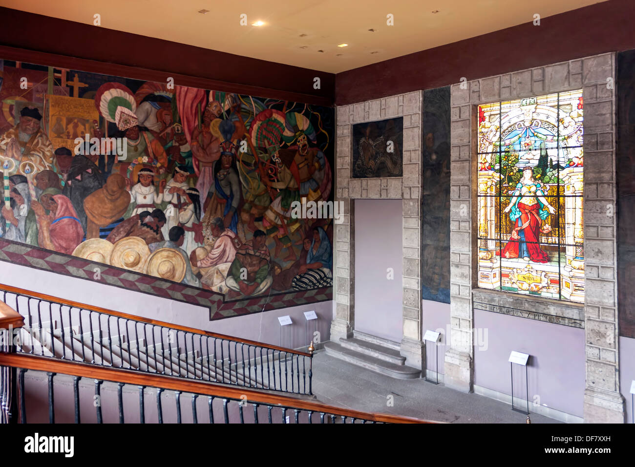 Wall mural and stained glass in Museo de la Ciudad de México, occupies the old Palacio de los Condes de Santiago de Calimaya. Stock Photo