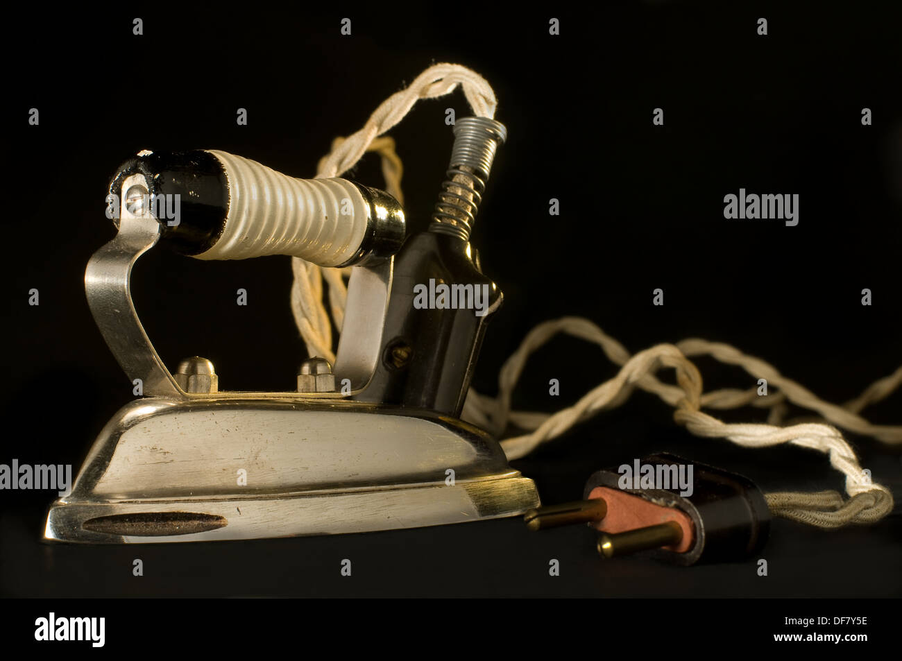 Antique electric iron on black background Stock Photo Alamy