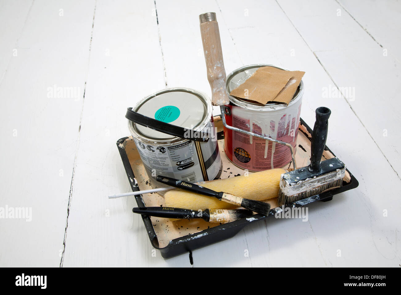 Paint tins empty roller brush brushes tray sandpaper small large used