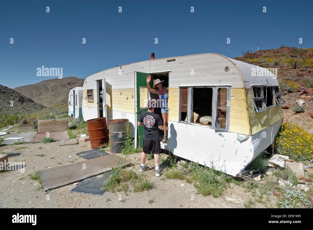 Woman waving in desert hires stock photography and images Alamy
