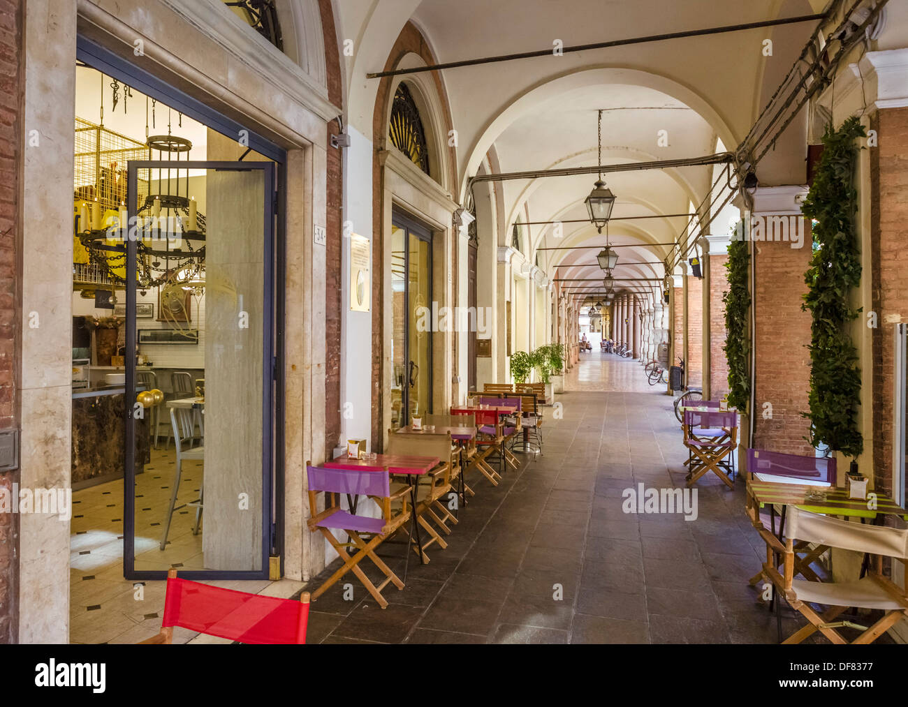 Cafe in a portico on Via San Carlo in the historic city centre, Modena, Emilia Romagna, Italy Stock Photo