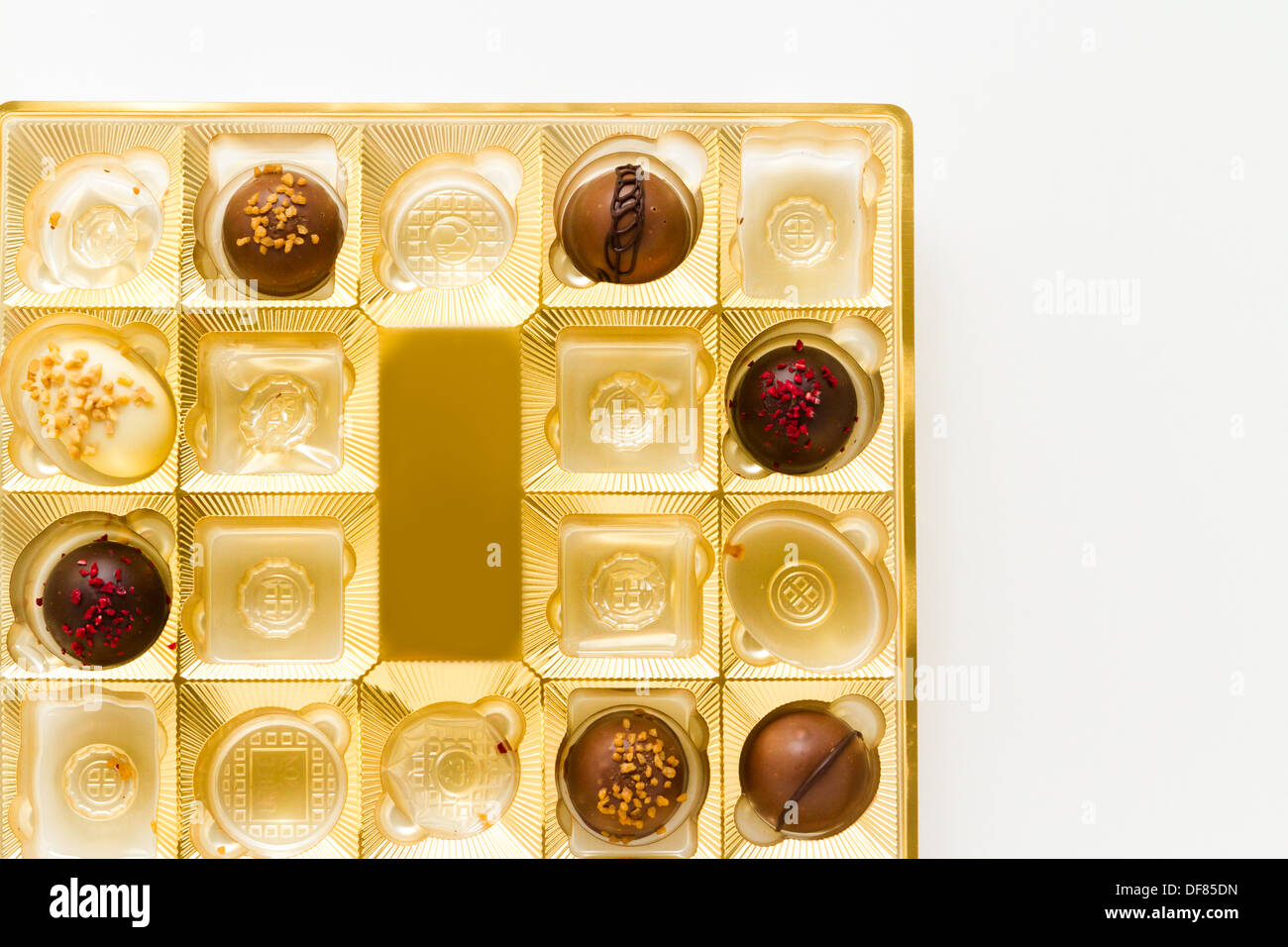 Gourmet chocolates in golden box on a white background Stock Photo Alamy