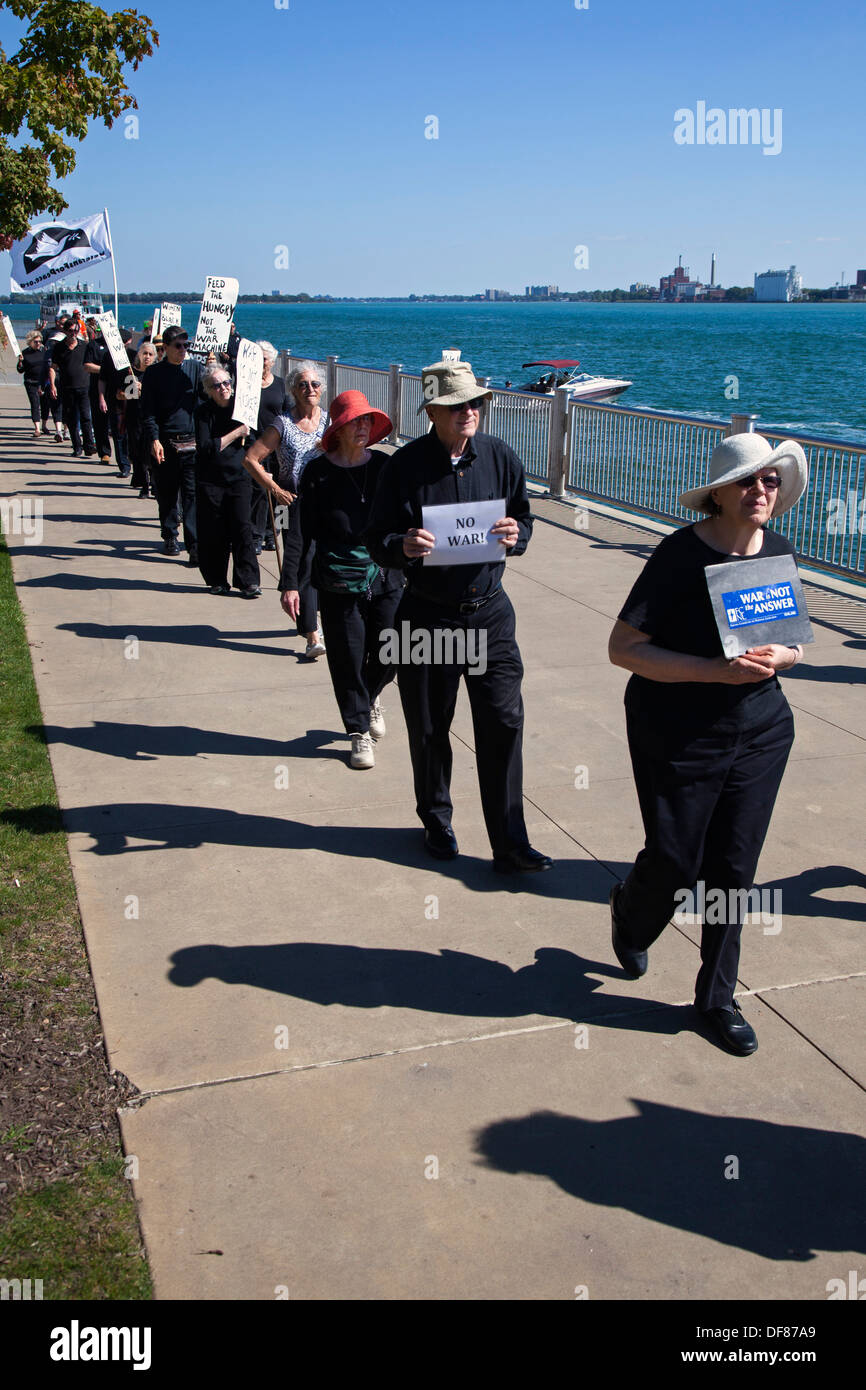 Detroit, Michigan - Members of Women in Black, an anti-war group, march silently along the Detroit Riverwalk. Stock Photo