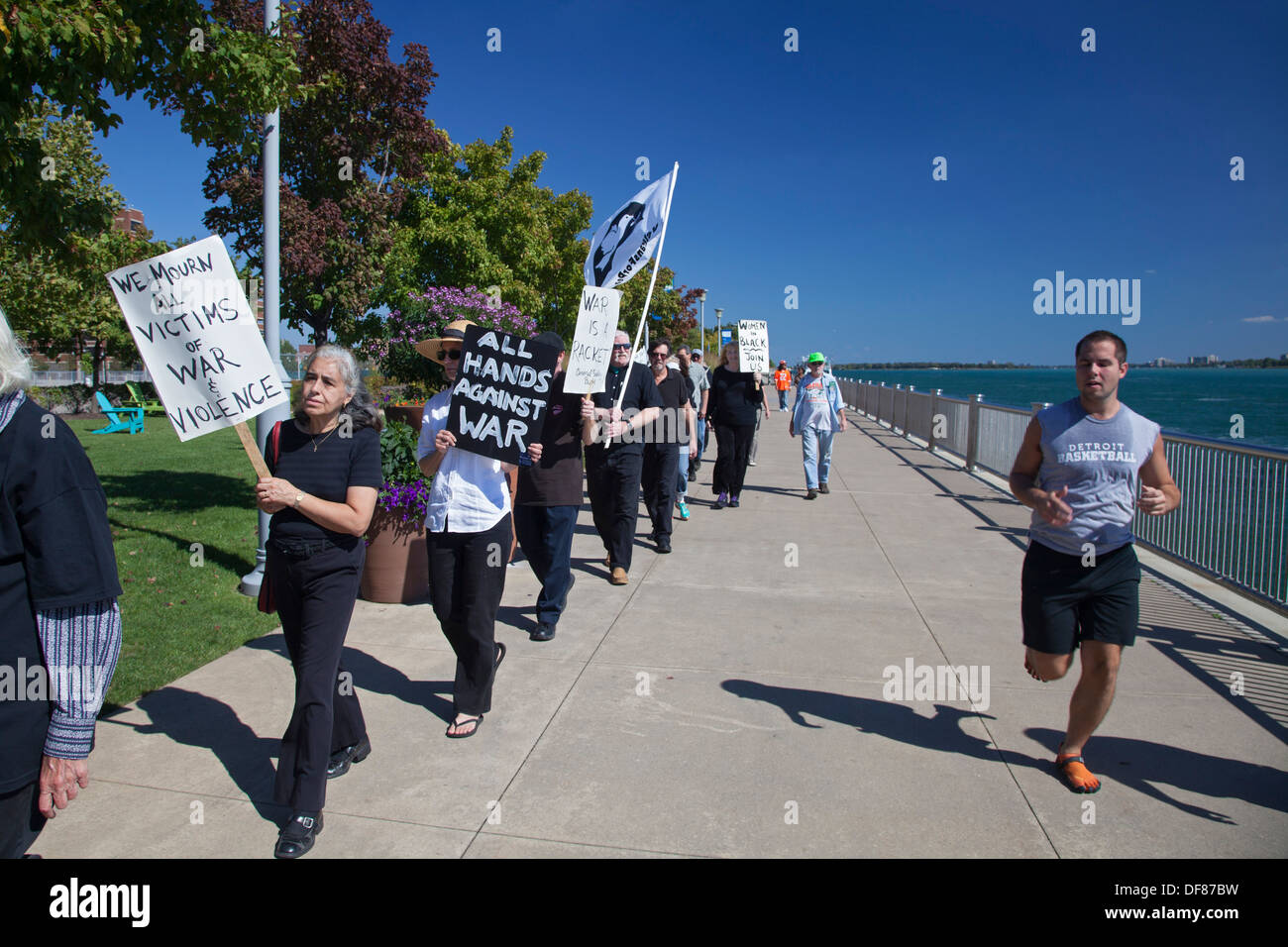 Detroit, Michigan - Members of Women in Black, an anti-war group, march silently along the Detroit Riverwalk. Stock Photo