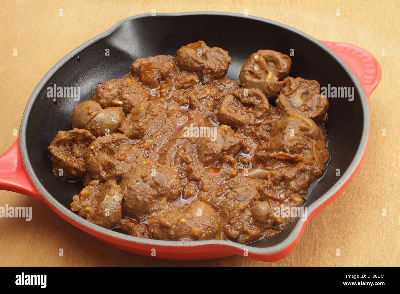 Lamb kidney bhuna curry frying in a pan Stock Photo Alamy