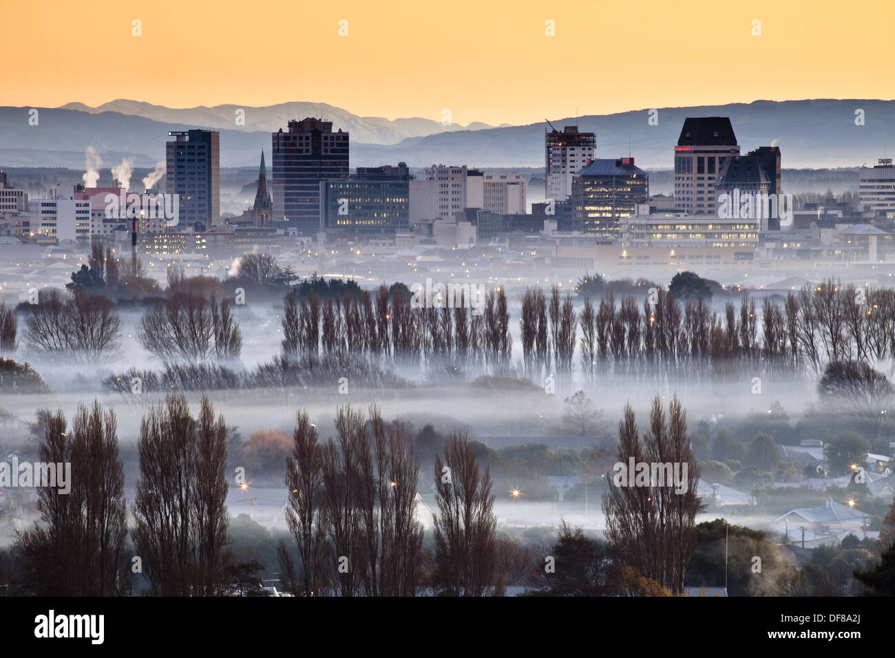 Smog and smoke from wood and coal fires at dawn blankets central city, taken from Port hills, Christchurch, Canterbury, New Stock Photo