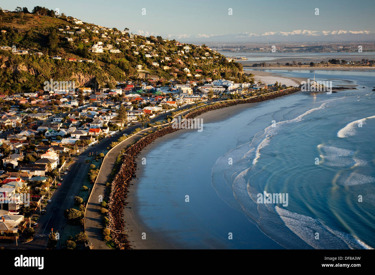 Sumner beach suburb near Christchurch, snow covered Southern Alps behind, South Island, New Zealand. Stock Photo