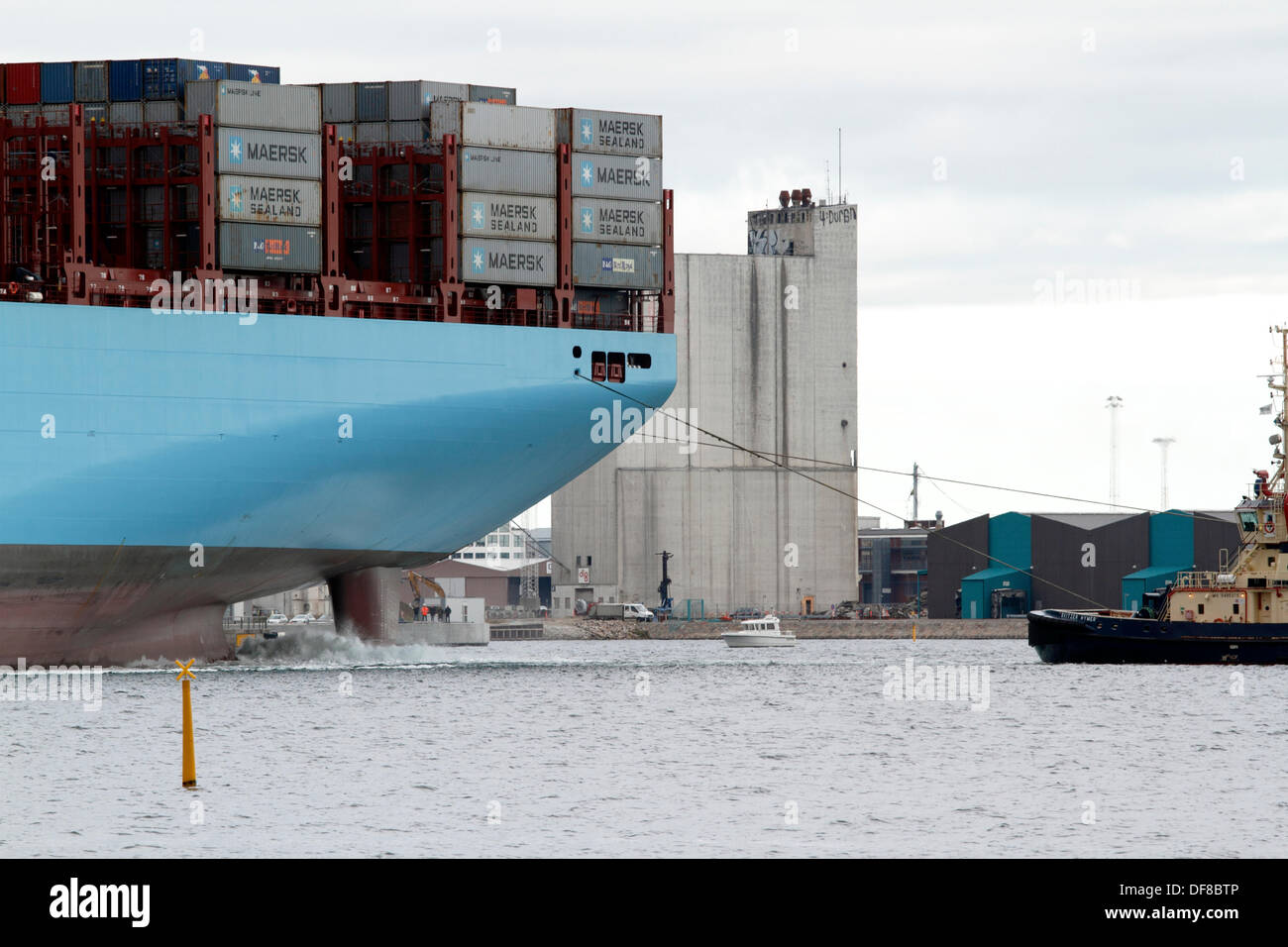 Copenhagen, Denmark. 30th Sep, 2013. The Majestic Maersk left the Langelinie quay in Copenhagen after one week's official naming ceremony and presentation to Maersk relations and the Danish public. Majestic Maersk, now heading for Gothenburg in Sweden to enter the container service between Europe and Asia, will probably never visit Copenhagen again as it is off-route and not suitable for this size of ship. By help of own propellers and four Svitzer tugs the ship was backed out of the harbour, as it is too shallow and small for a triple-E class ship to turn. Credit:  Niels Quist/Alamy Live News Stock Photo