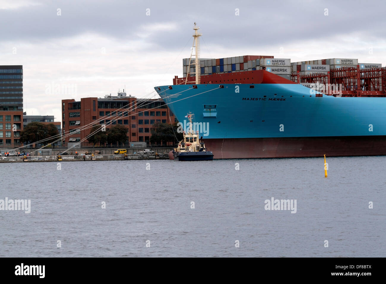 Copenhagen, Denmark. 30th Sep, 2013. The Majestic Maersk left the Langelinie quay in Copenhagen after one week's official naming ceremony and presentation to Maersk relations and the Danish public. Majestic Maersk, now heading for Gothenburg in Sweden to enter the container service between Europe and Asia, will probably never visit Copenhagen again as it is off-route and not suitable for this size of ship. By help of own propellers and four Svitzer tugs the ship was backed out of the harbour, as it is too shallow and small for a triple-E class ship to turn. Credit:  Niels Quist/Alamy Live News Stock Photo