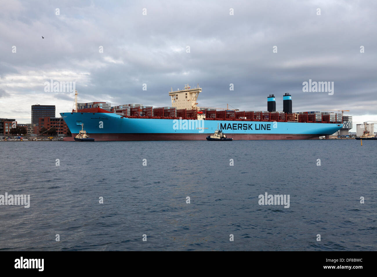 Copenhagen, Denmark. 30th Sep, 2013. The Majestic Maersk left the Langelinie quay in Copenhagen after one week's official naming ceremony and presentation to Maersk relations and the Danish public. Majestic Maersk, now heading for Gothenburg in Sweden to enter the container service between Europe and Asia, will probably never visit Copenhagen again as it is off-route and not suitable for this size of ship. By help of own propellers and four Svitzer tugs the ship was backed out of the harbour, as it is too shallow and small for a triple-E class ship to turn. Credit:  Niels Quist/Alamy Live News Stock Photo