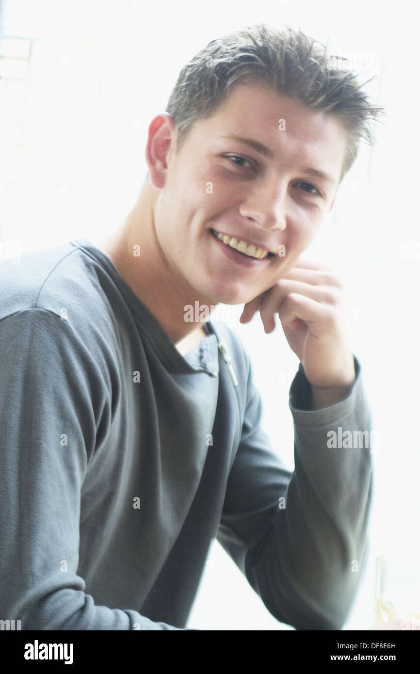 21 year old man, head and shoulders, smiling into camera Stock Photo