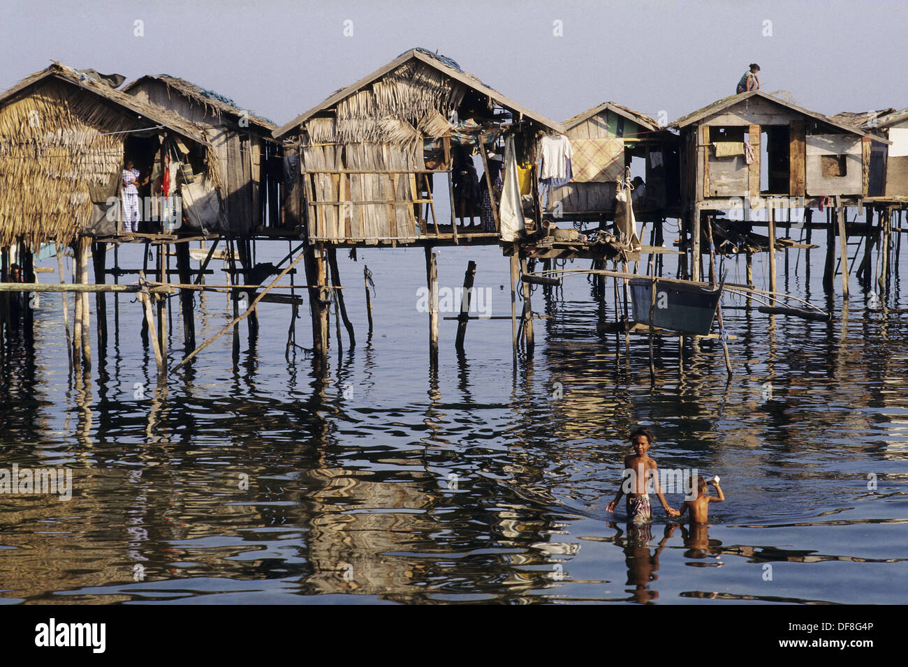 Sea gypsies by their stilt houses near Zamboanga, Philippines Stock