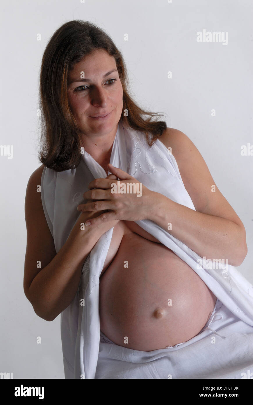 Woman pregnant with twins Stock Photo