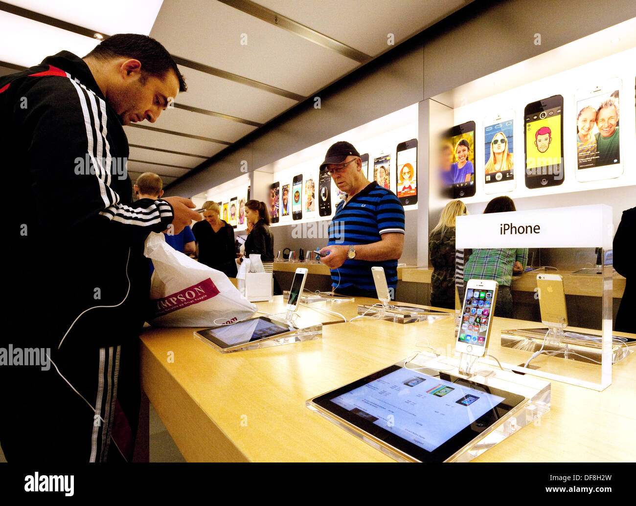 The iPhone 5S on sale in the Apple store interior, Grand arcade Cambridge UK Stock Photo