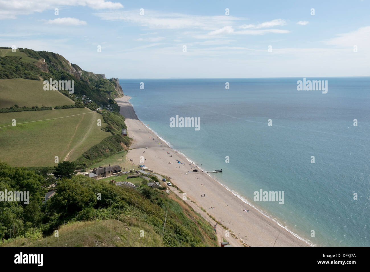 Branscombe beach shingle, sand, blue sea and sky with cliffs on the Jurassic Coast of East Devon in summer Stock Photo