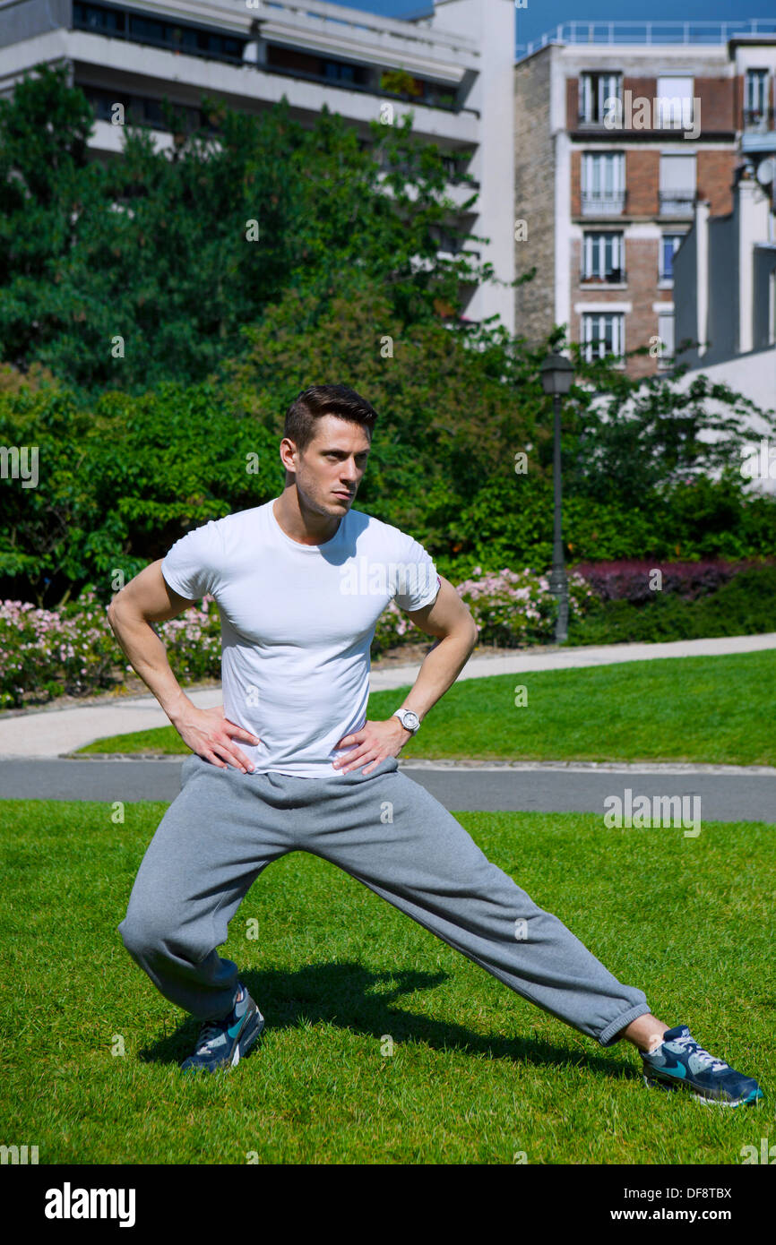 Sporty man stretching legs hi-res stock photography and images - Alamy