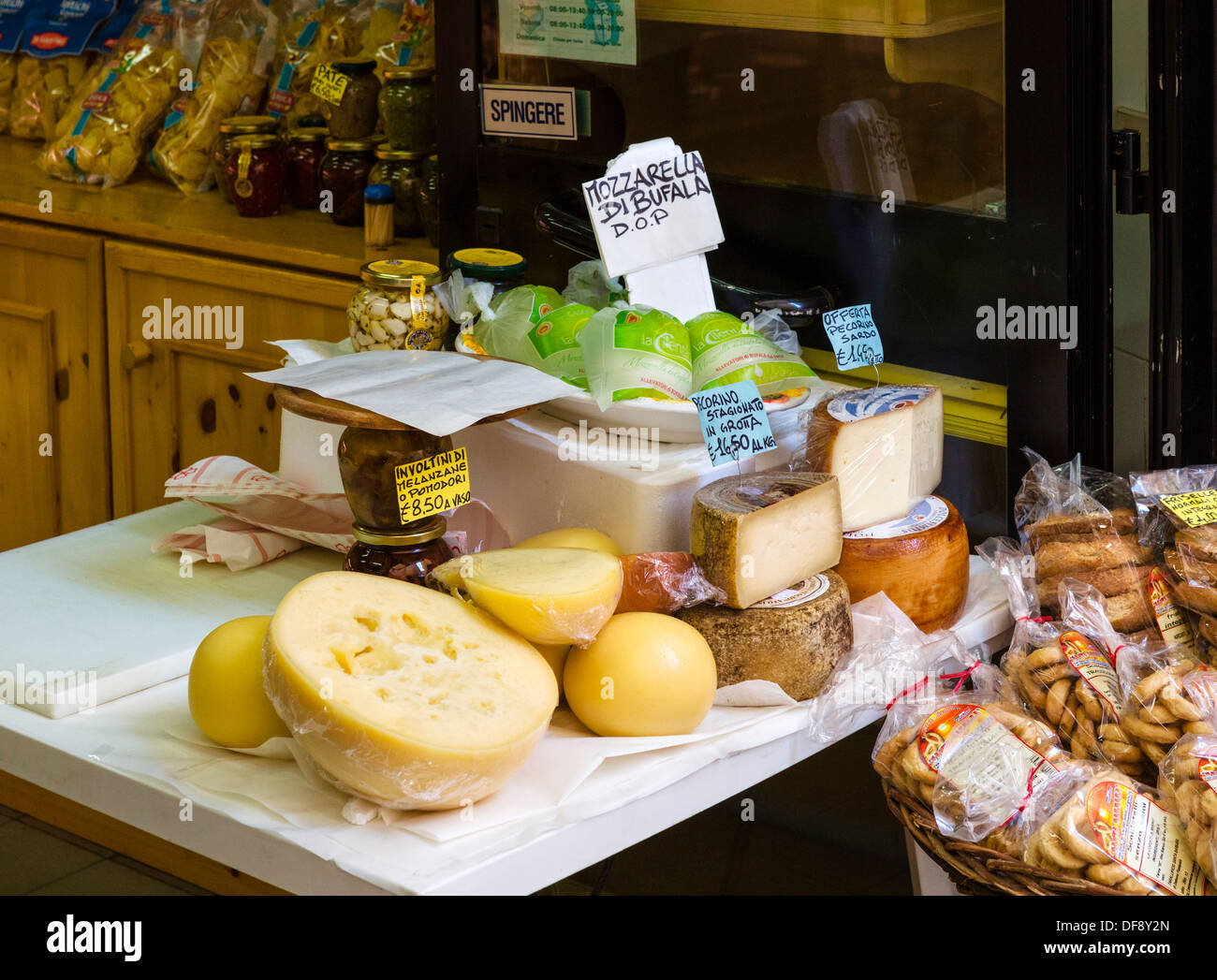 Cheese and other local regional produce in a shop in Reggio Emilia (Reggio nell'Emilia), Emilia Romagna, Italy Stock Photo