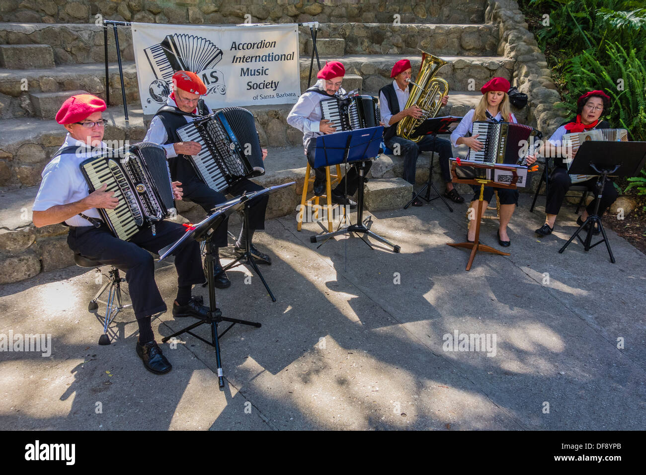 The Accordion International Musical Society playing outside and wearing red berets in Santa Barbara, California. Stock Photo