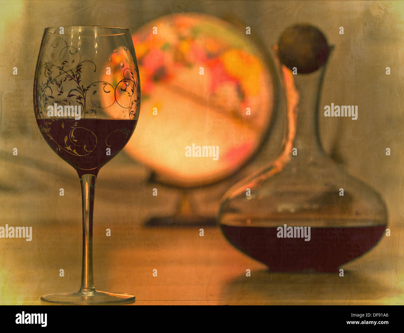 Still life image of a glass of wine, carafe and a globe. Stock Photo