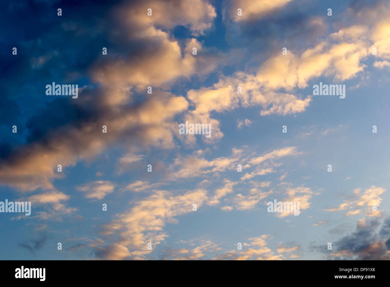 Cloudy sky in the evening sun Stock Photo
