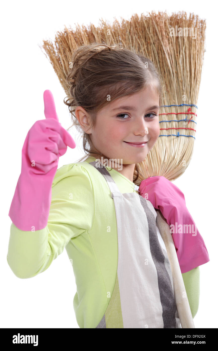 Little girl with broom Stock Photo Alamy
