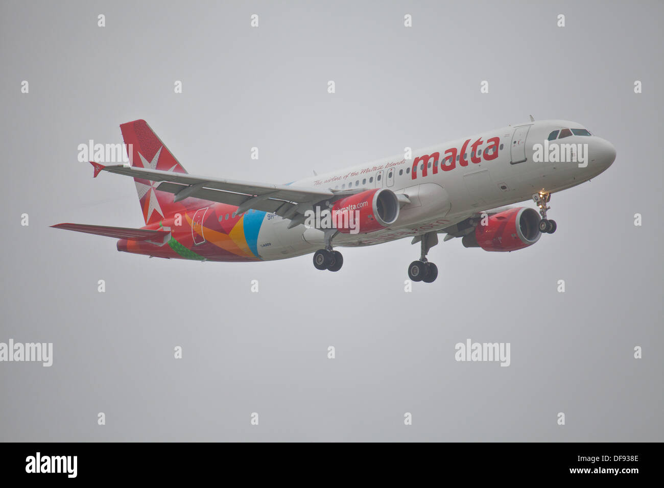 Air malta airbus a320 landing at heathrow airport hires stock