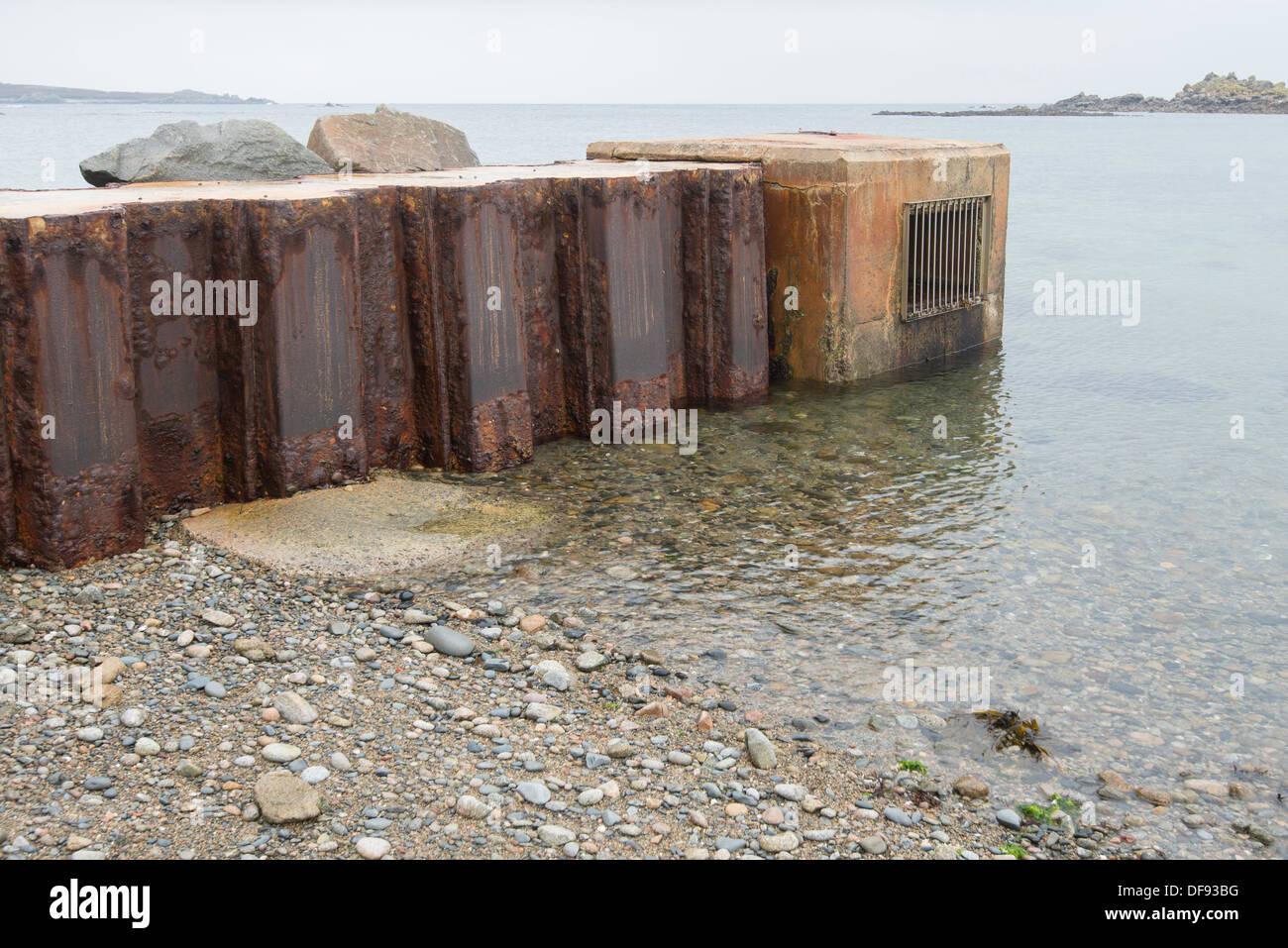 Surface water outfall pipe on beach Stock Photo