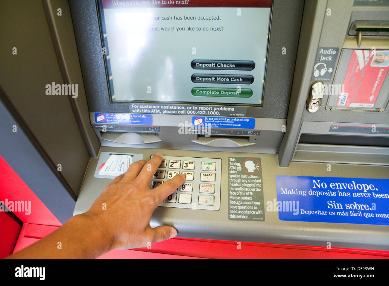 Using keypad on Bank of America ATM - USA Stock Photo