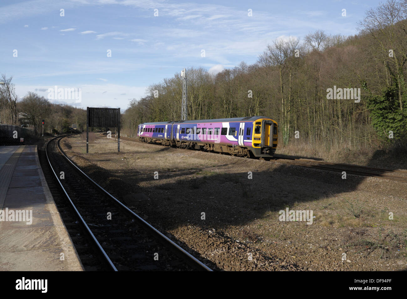 A Northern Rail class 158 passenger train passing Dore station in Sheffield England Stock Photo