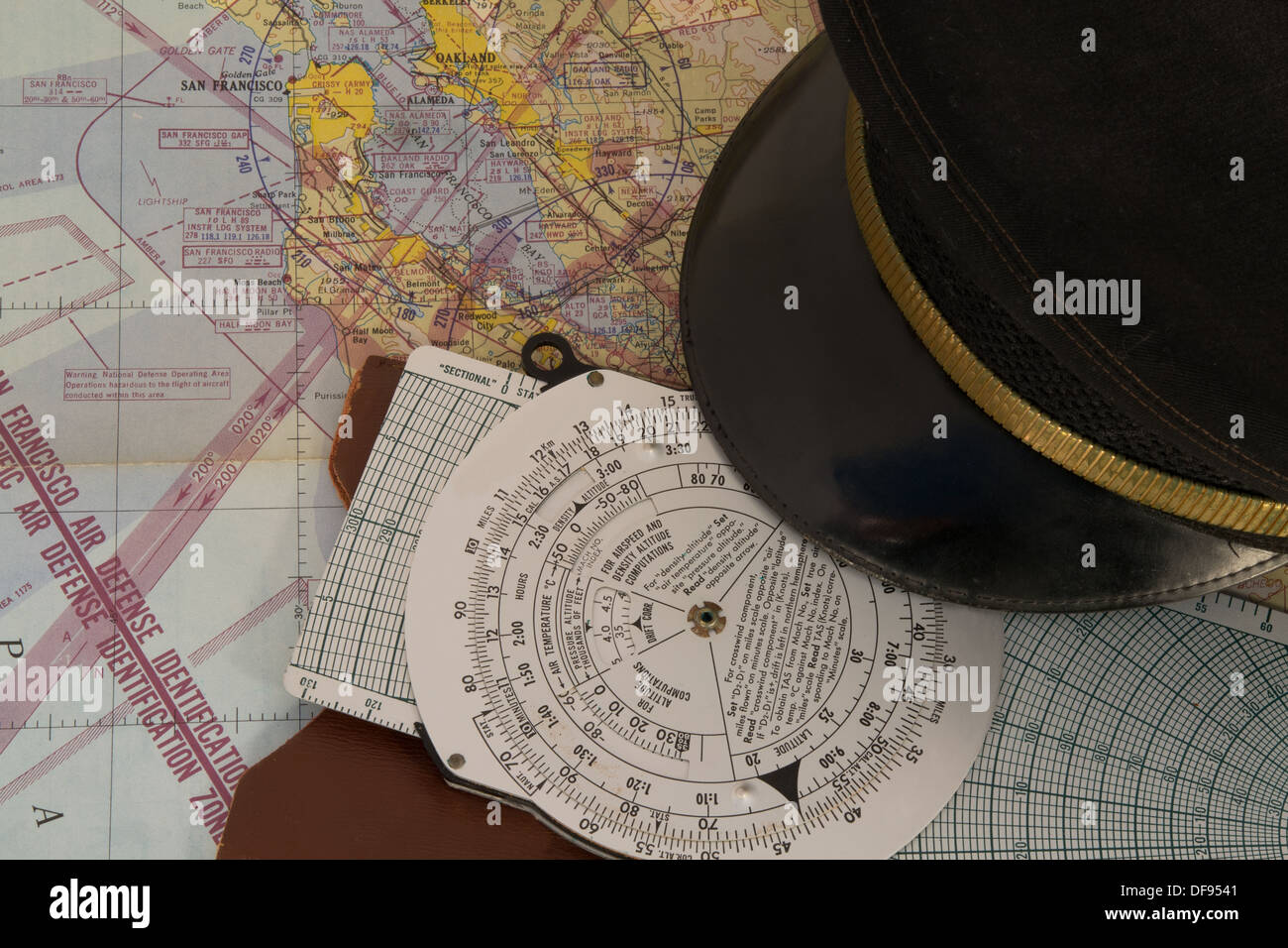 A 1950's vintage aviation chart, flight computer and airline hat Stock Photo
