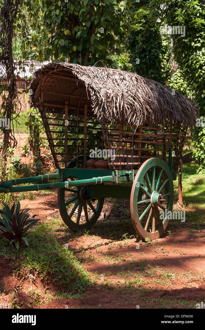 Old, green, wooden cart on two wheels. Stock Photo