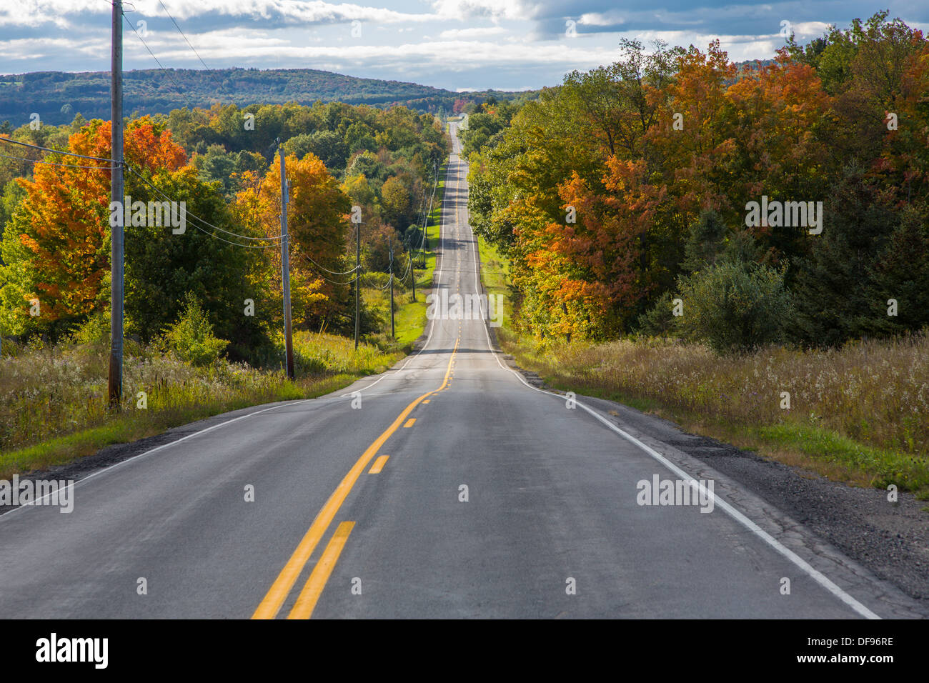 Road in Finger Lakes area of New York State with fall colors Stock Photo